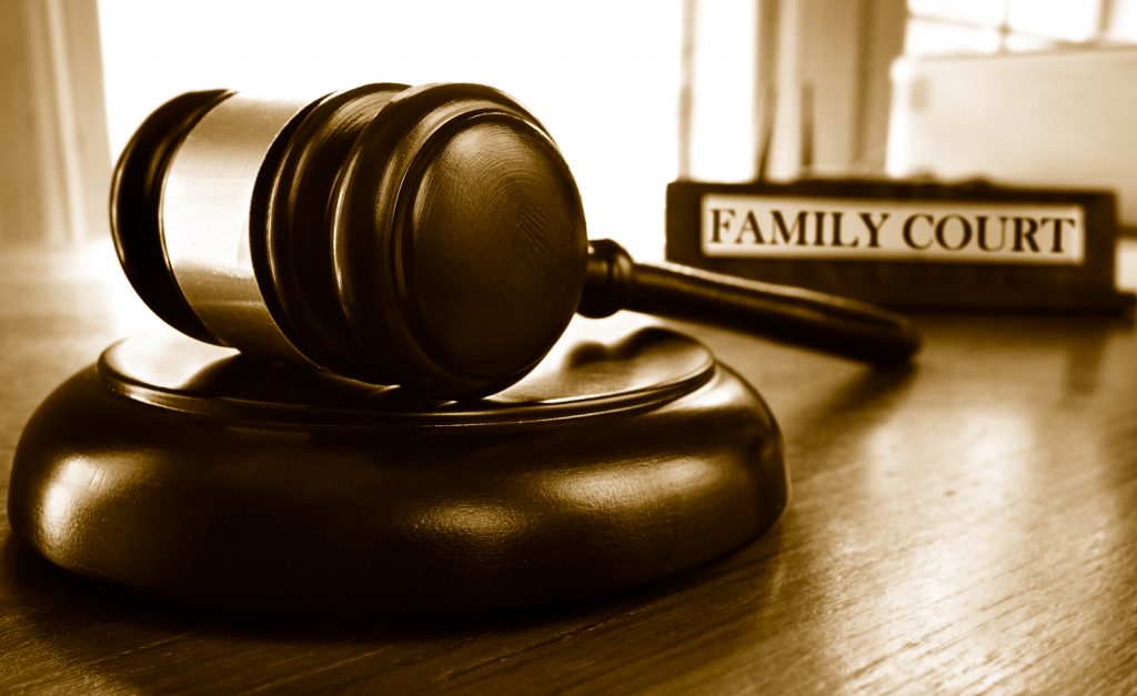 Maine divorce attorney gavel and family court book.
